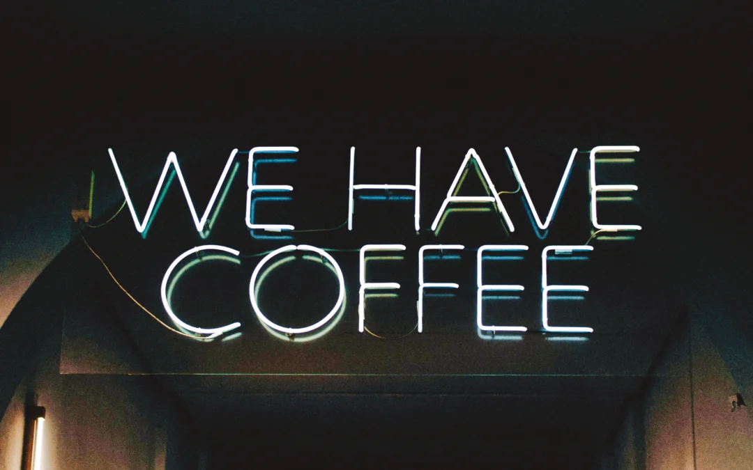 Neon sign at a coffee shop saying "we have coffee"